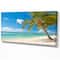 Designart - Palm tree over white sand - Landscapes Sea & Shore Photographic on wrapped Canvas